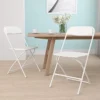 EMMA + OLIVER Set Of 2 White Stackable Folding Plastic Chairs - 650 LB Weight Capacity